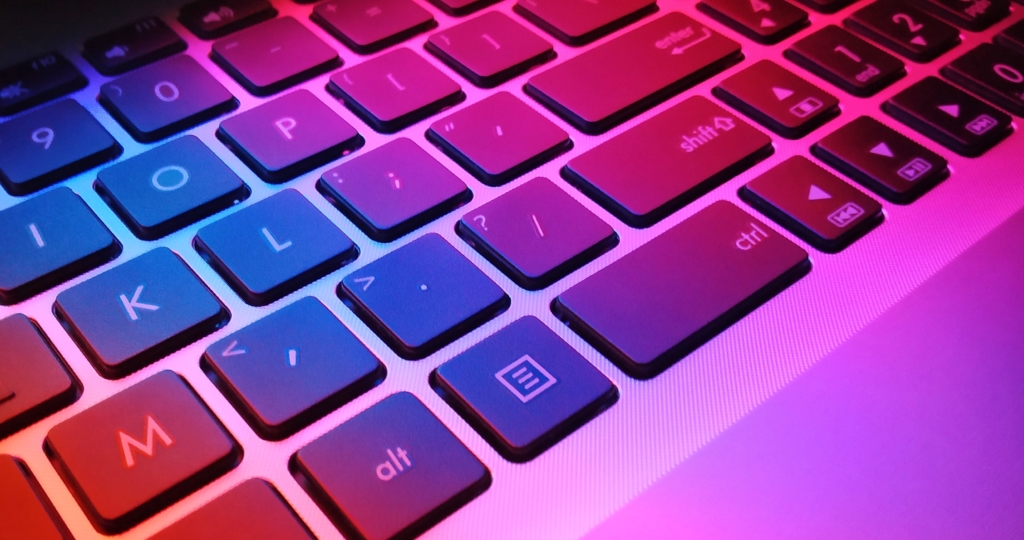 Keyboard in blue, red, and pink lighting,